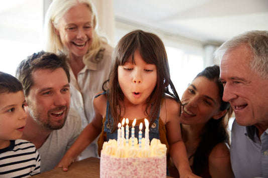 Family celebrating a child’s birthday with a soft celebration cake in Melbourne