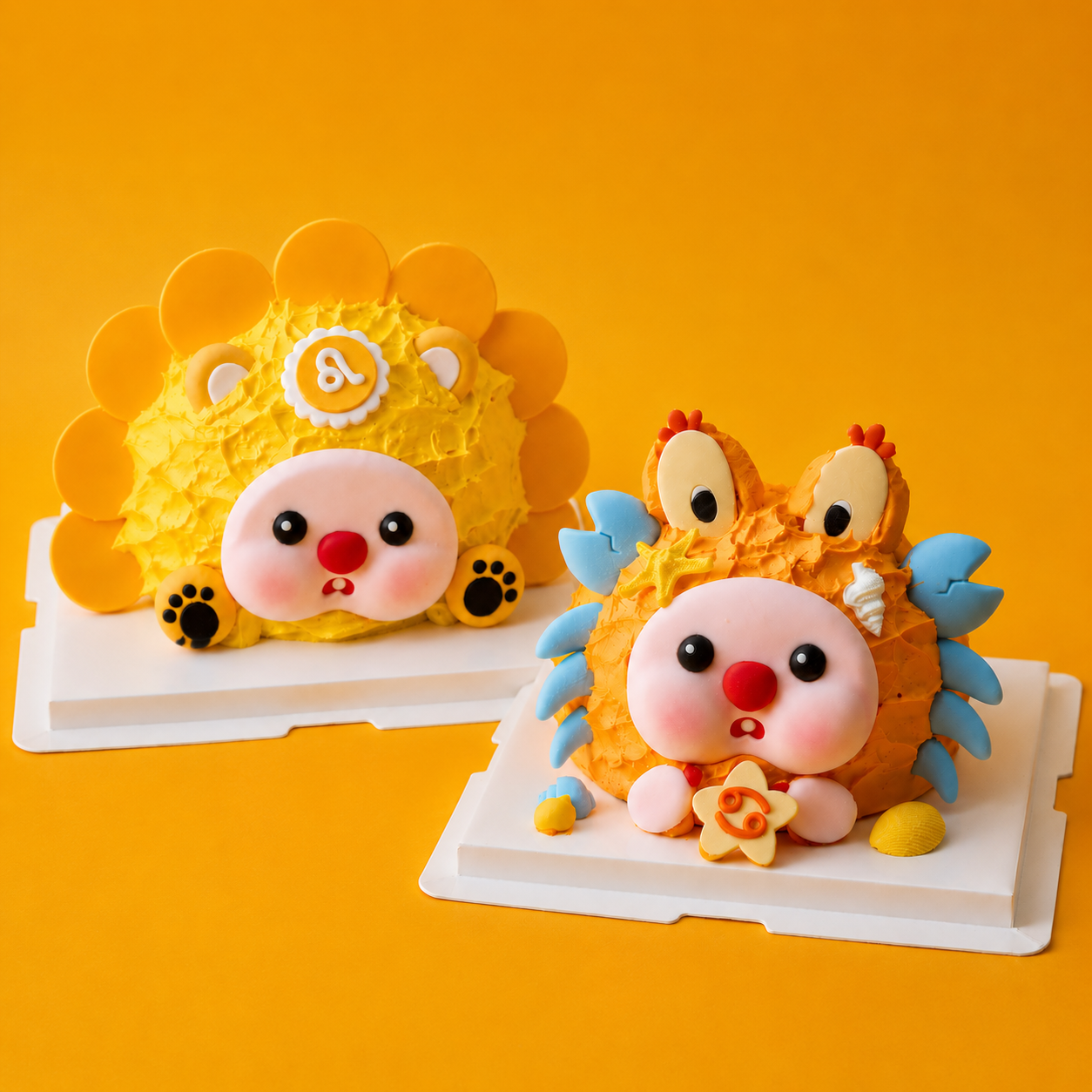 Leo and Cancer constellation character cakes on an orange background